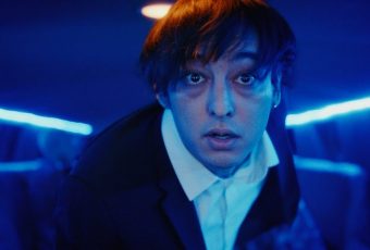 Joji literally runs from fame in his new music video